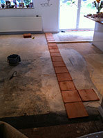 45 square metres of terracotta floor going down (Godalming)