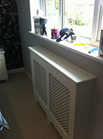 Radiator and window after refurbishment and enclosure in radiator cover